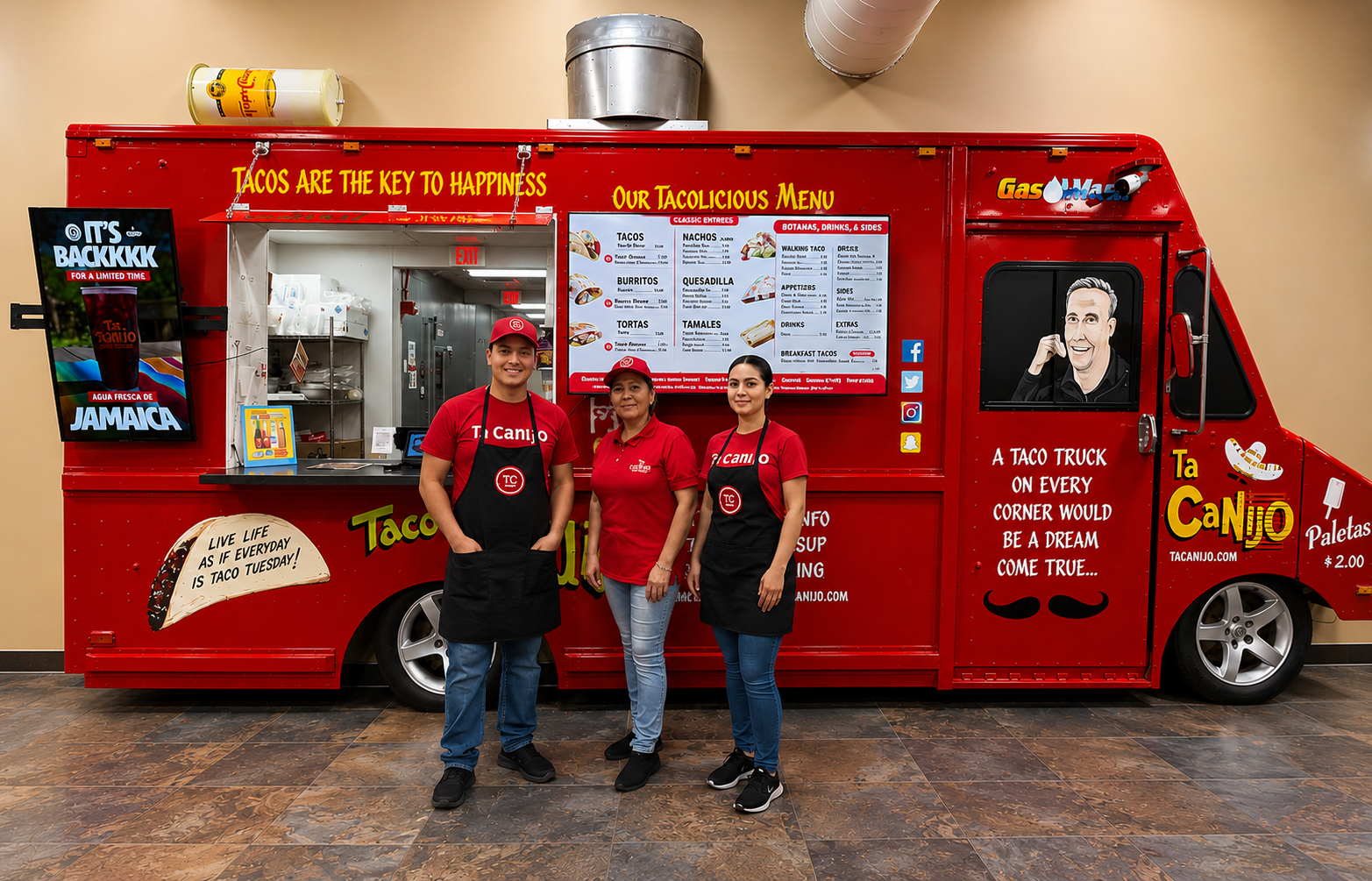 Three Ta Canijo team members in red shirts and black aprons standing in front of the red taco truck